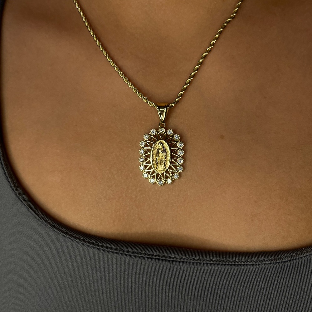 Brand new gold Virgin Mary necklace with clear stones.